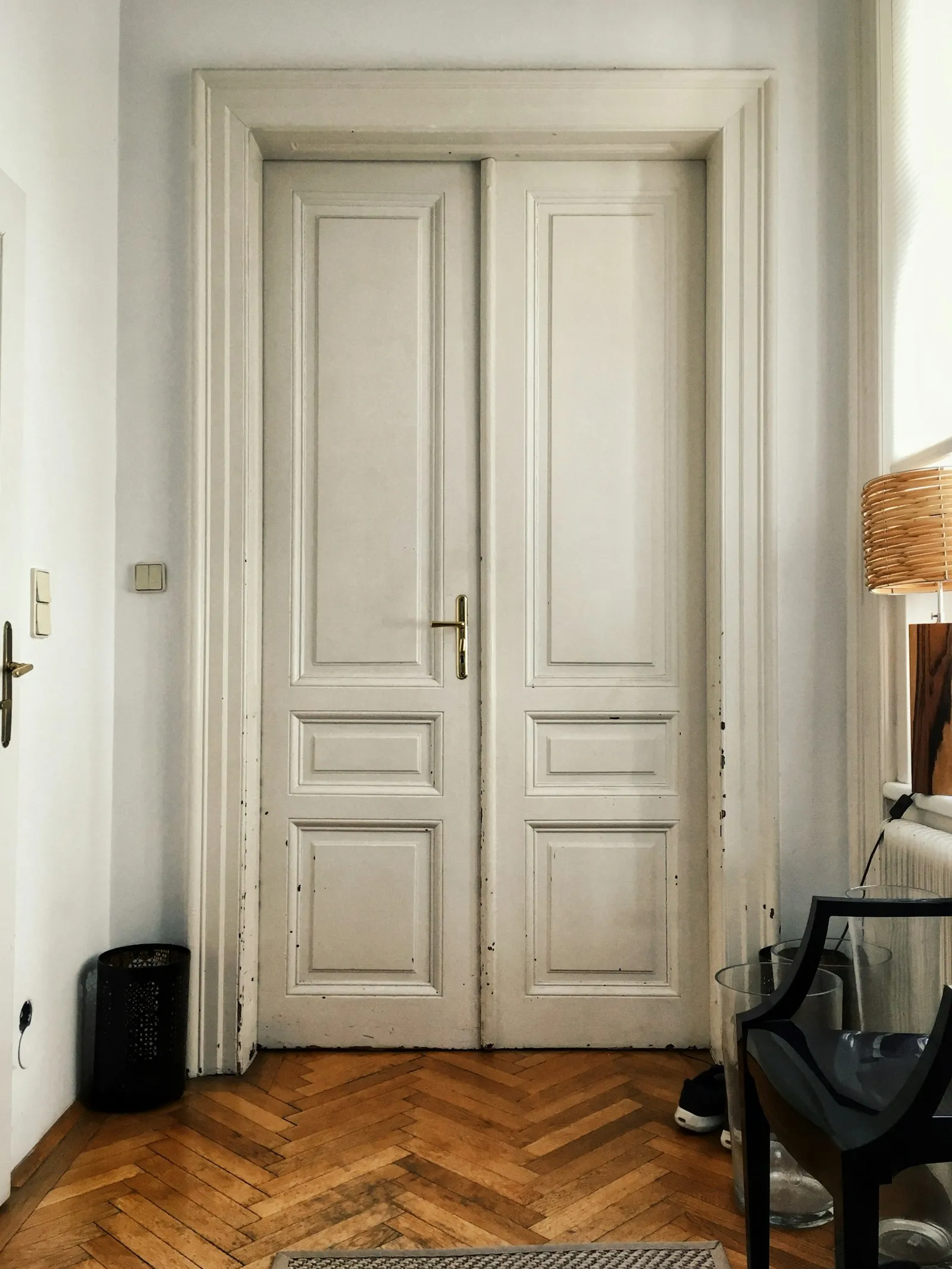 Interior hallway with a closed apartment door — a common scenario for wall-listening