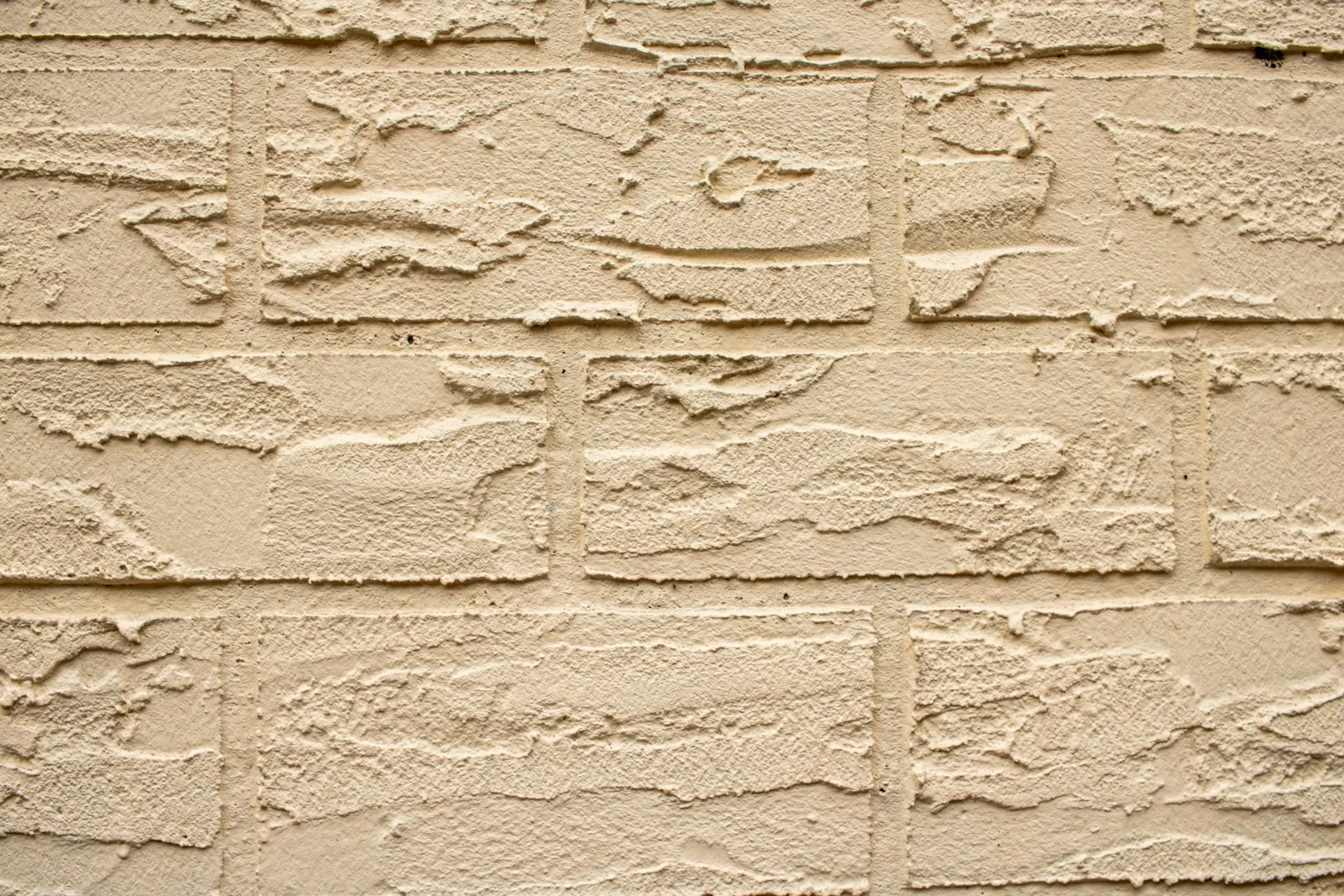 Textured beige brick wall — sound-blocking material where apps hit their limits